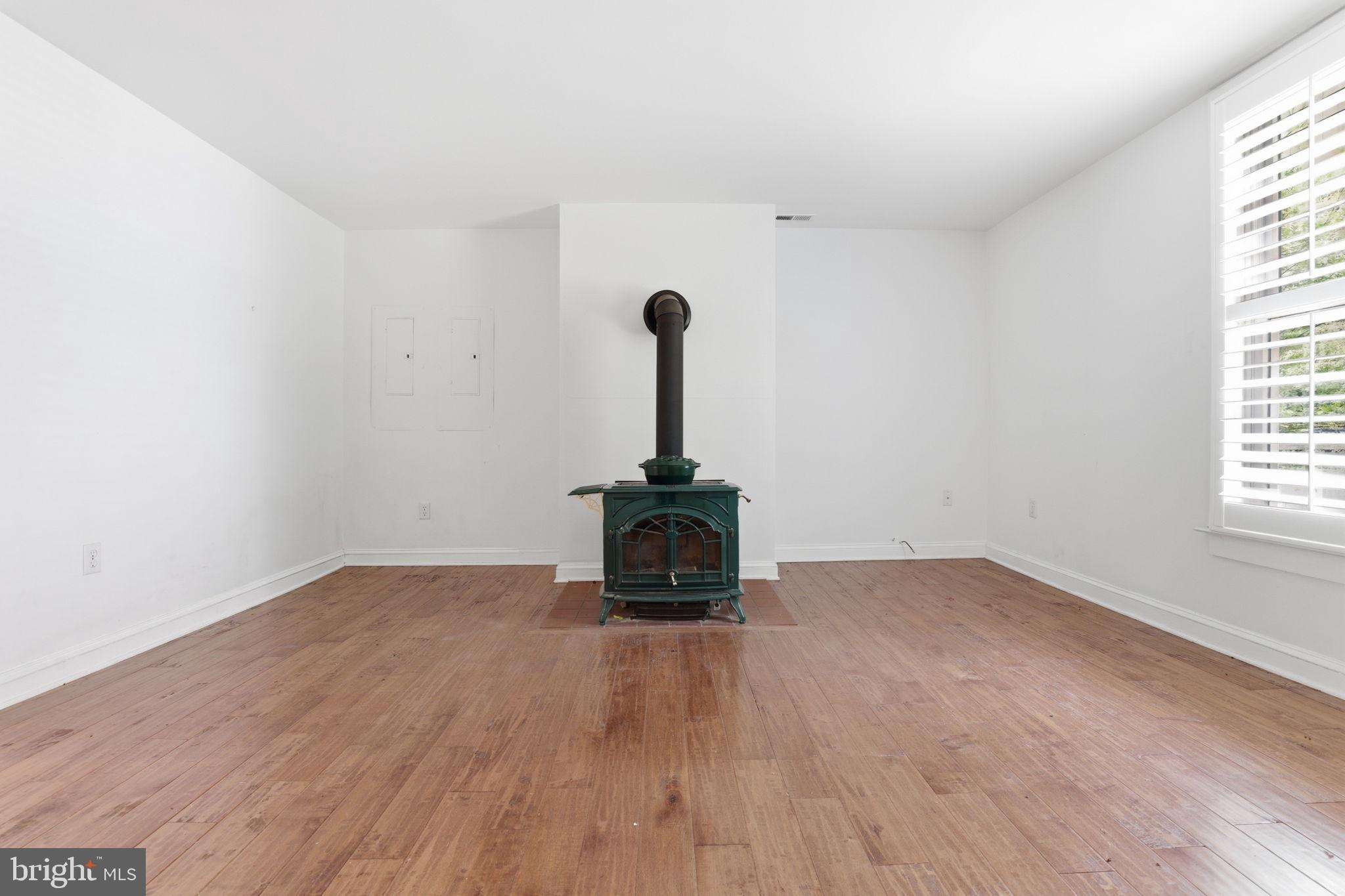 5865 Deale Beach Road Deale, MD 20751 - Photo 15 of 50 Cozy space with a charming stove.