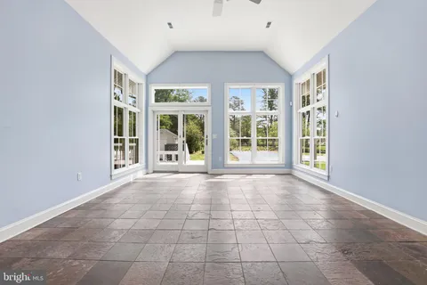 a view of an empty room with windows