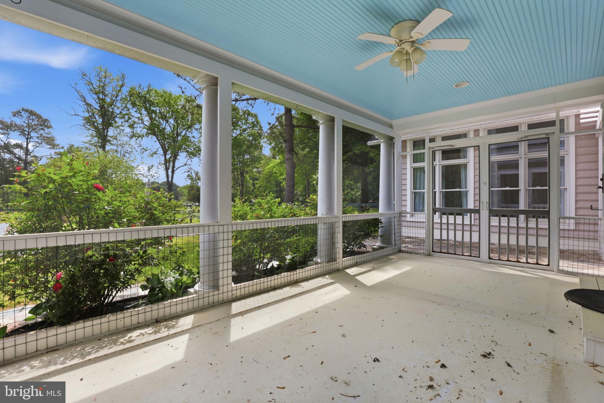 5865 Deale Beach Road Deale, MD 20751 - Photo 22 of 50 Serene porch with lush garden views.