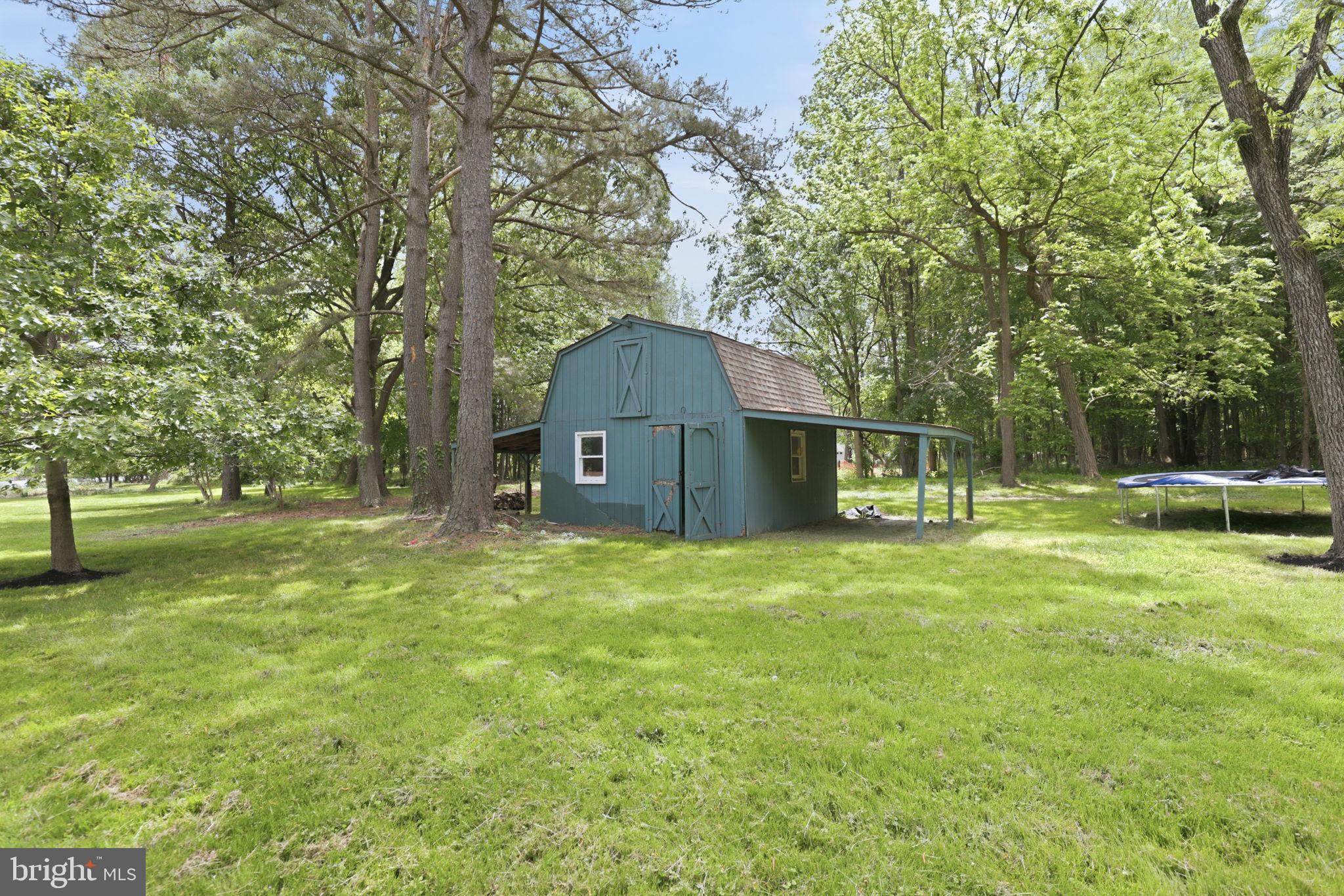 5865 Deale Beach Road Deale, MD 20751 - Photo 24 of 50 Charming barn nestled in lush greenery.