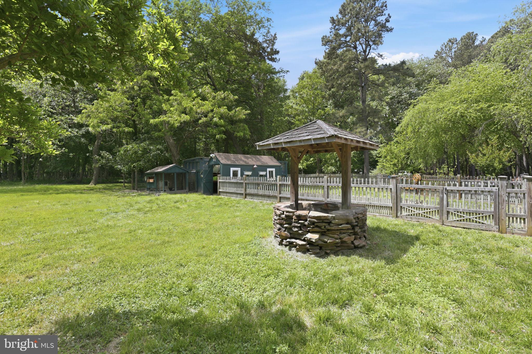 5865 Deale Beach Road Deale, MD 20751 - Photo 25 of 50 Charming garden with a rustic well.