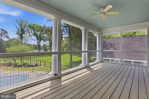 a view of a balcony with wooden floor