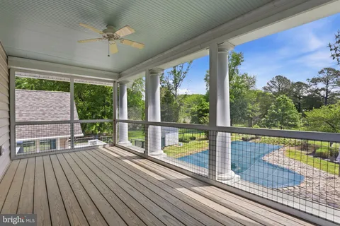 a view of balcony with wooden floor