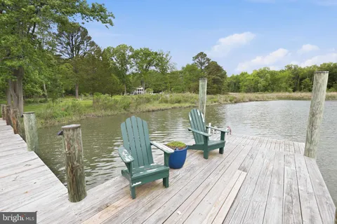 a lake view with a wooden floor and city view