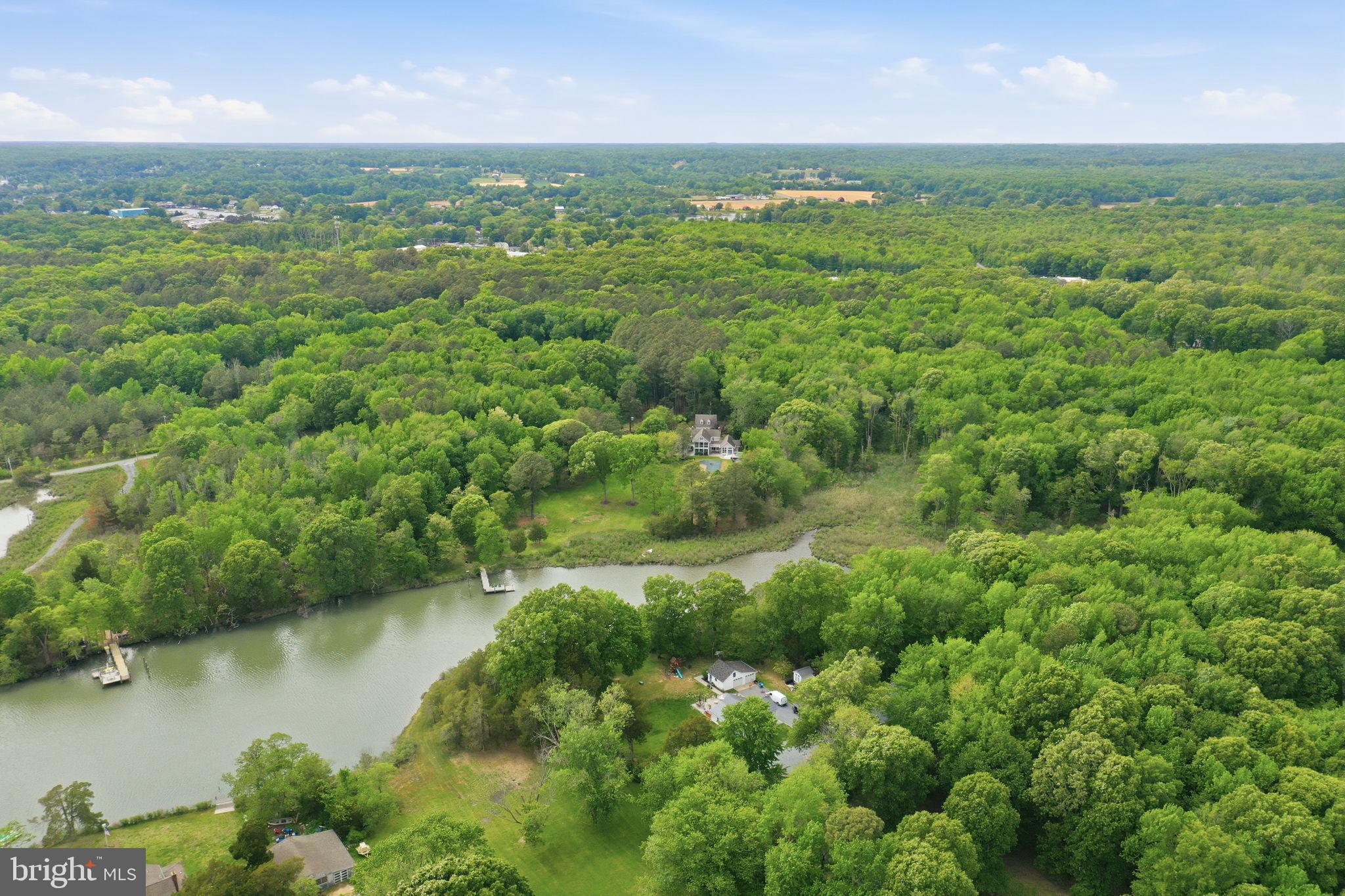 5865 Deale Beach Road Deale, MD 20751 - Photo 48 of 50 Serene lakeside retreat in lush greenery.
