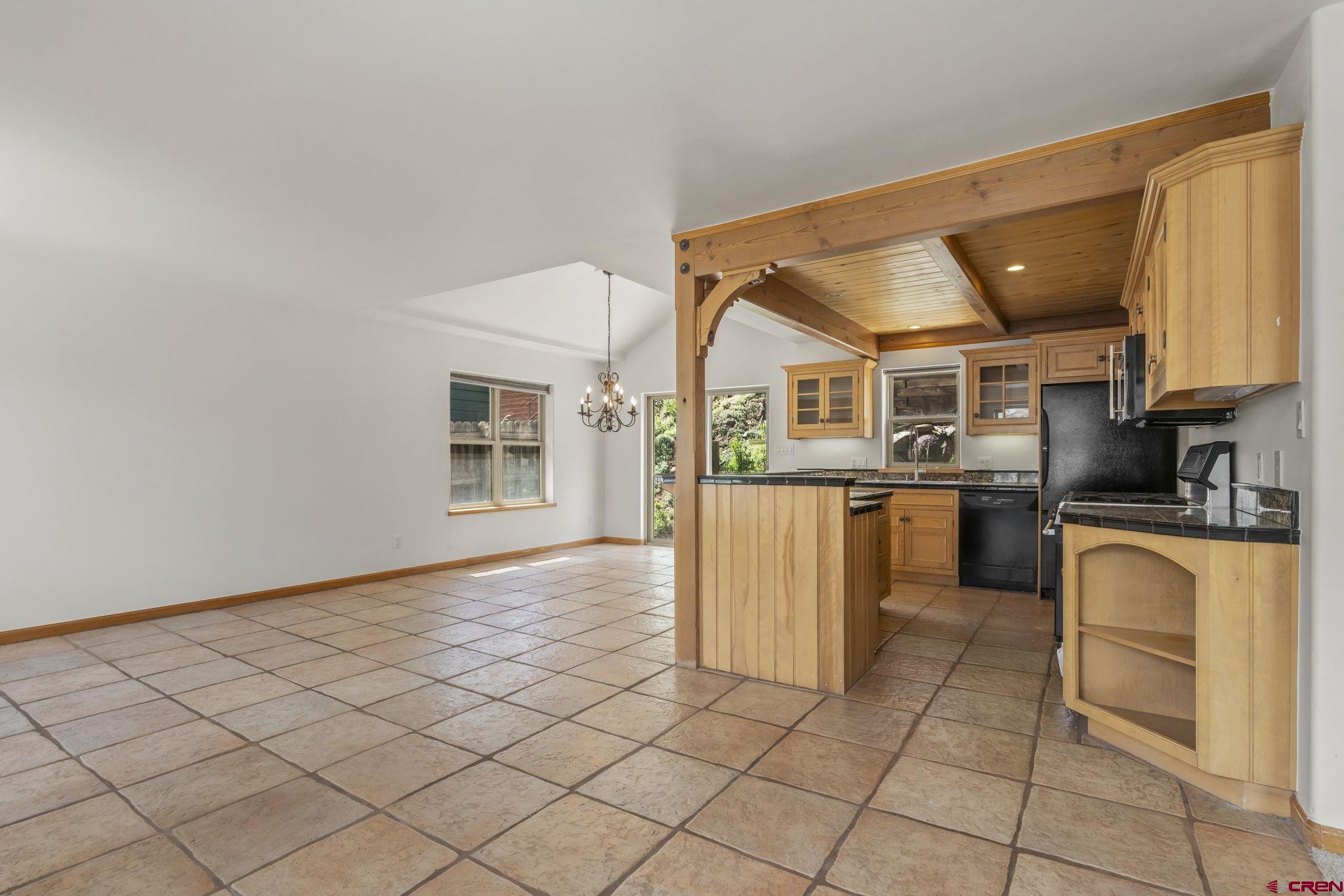 2015 West 3rd Avenue Durango, CO 81301 - Photo 14 of 32 a kitchen with stainless steel appliances granite countertop a stove a sink and a microwave