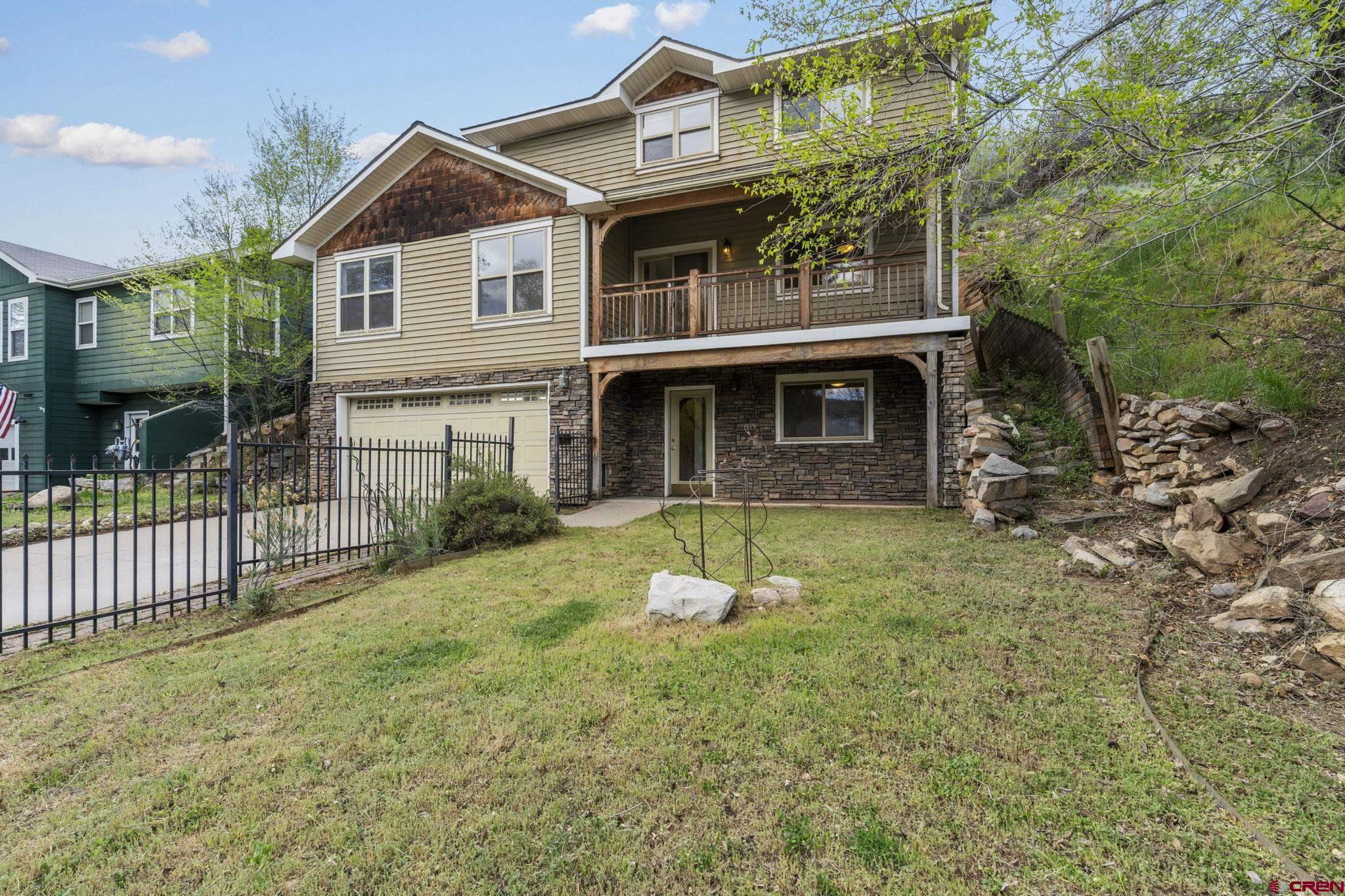 2015 West 3rd Avenue Durango, CO 81301 - Photo 2 of 32 a front view of a house with a yard