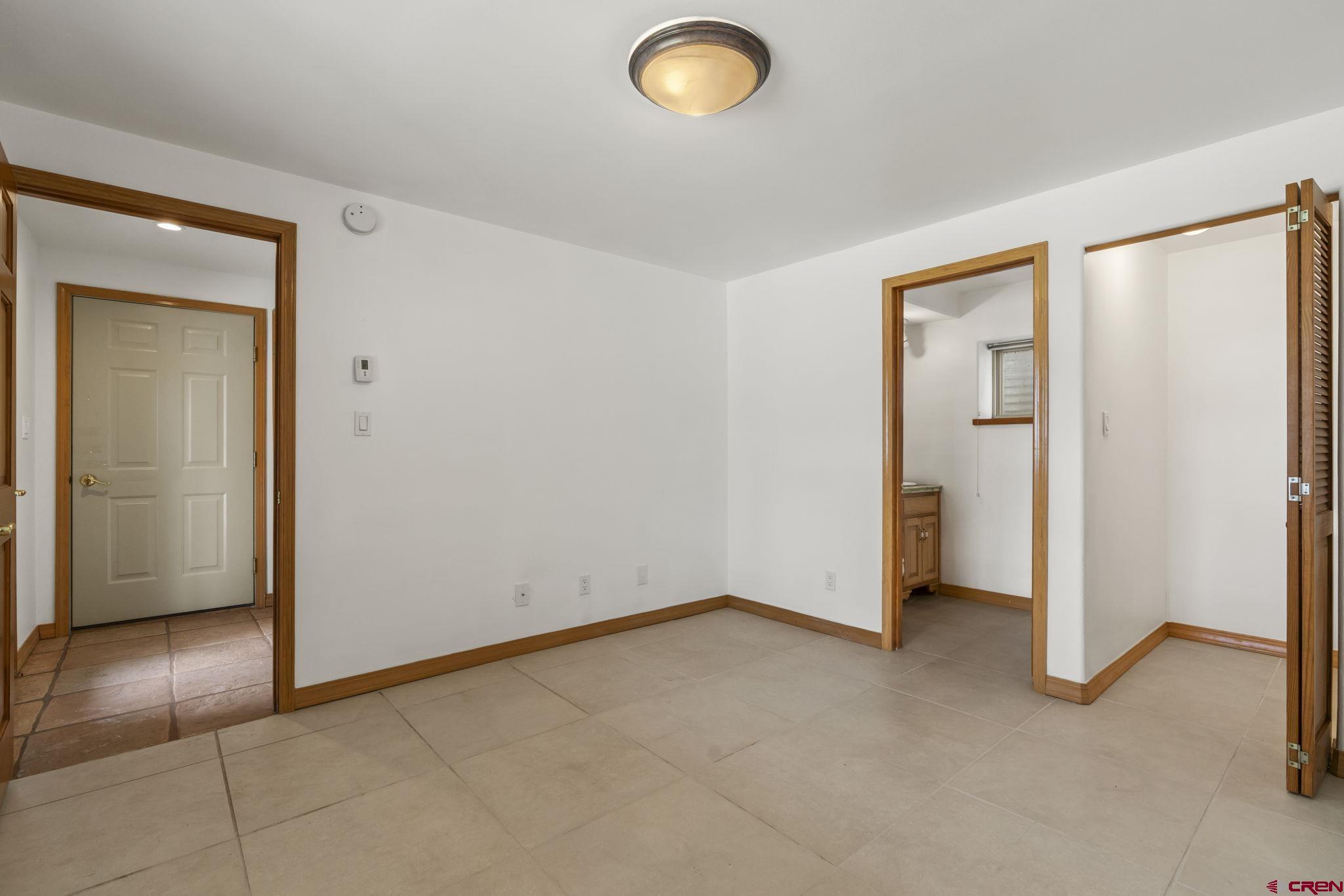 2015 West 3rd Avenue Durango, CO 81301 - Photo 3 of 32 an empty room with closet and mirror