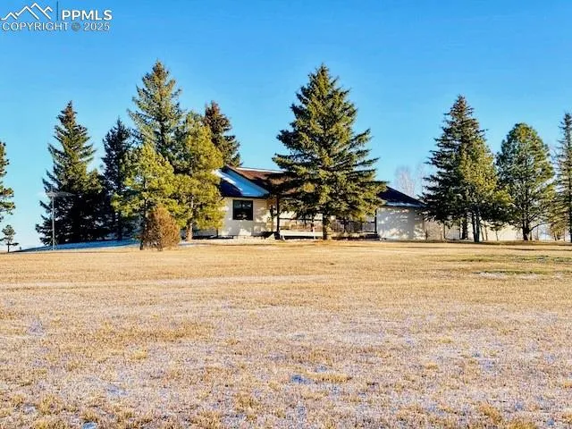 a view of a swimming pool with an outdoor space and seating area