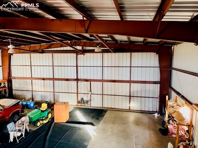 24988 Ben Kelly Road Elbert, CO 80106 - Photo 13 of 34 a view of a room with racks on the wall