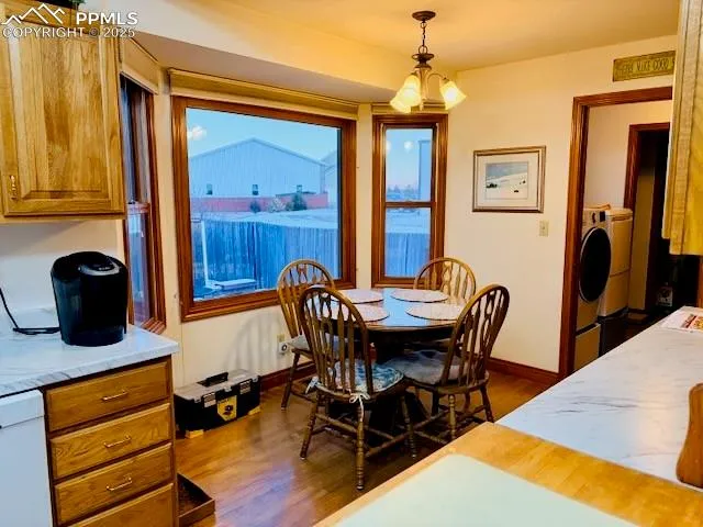 a living room with furniture a flat screen tv and a window