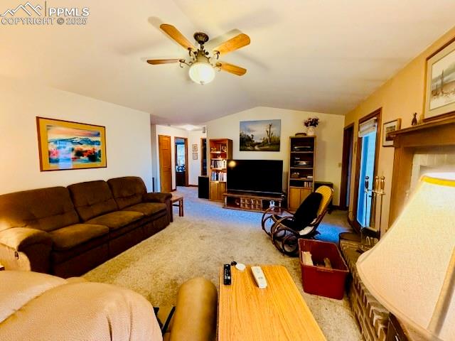 24988 Ben Kelly Road Elbert, CO 80106 - Photo 20 of 34 a living room with furniture a flat screen tv and a window