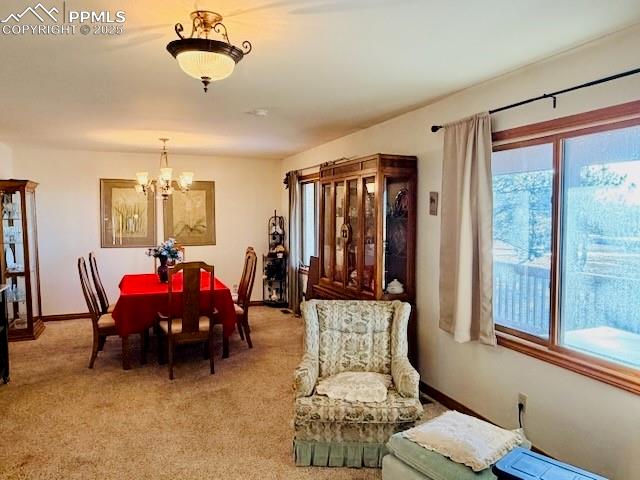 24988 Ben Kelly Road Elbert, CO 80106 - Photo 24 of 34 a living room with furniture a chandelier and a window