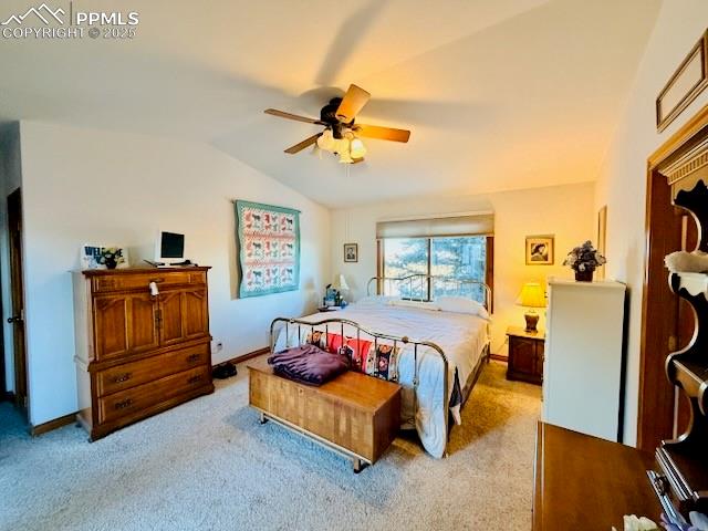 24988 Ben Kelly Road Elbert, CO 80106 - Photo 25 of 34 a living room with furniture and a flat screen tv