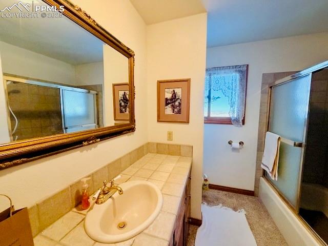 24988 Ben Kelly Road Elbert, CO 80106 - Photo 31 of 34 a bathroom with a tub and a sink