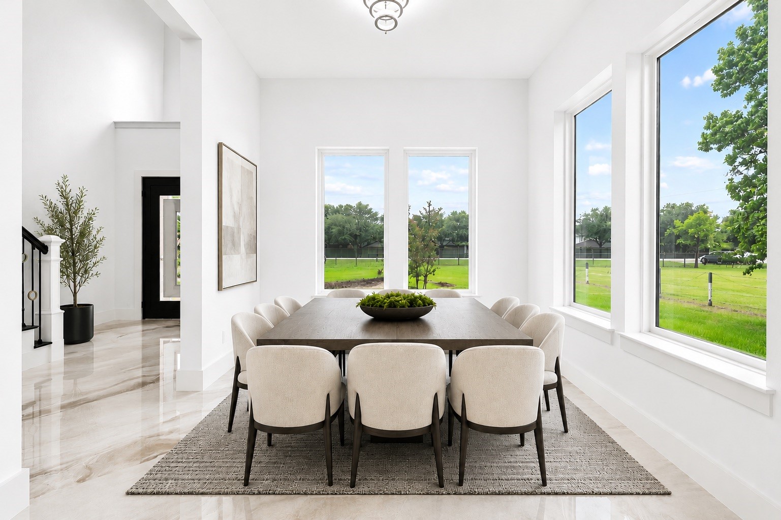 3237 Harkey Road Pearland, TX 77584 - Photo 6 of 46 *Virtually Staged*
Stunning formal dining space with expansive windows, sleek modern finishes, and ample room for entertaining in style.