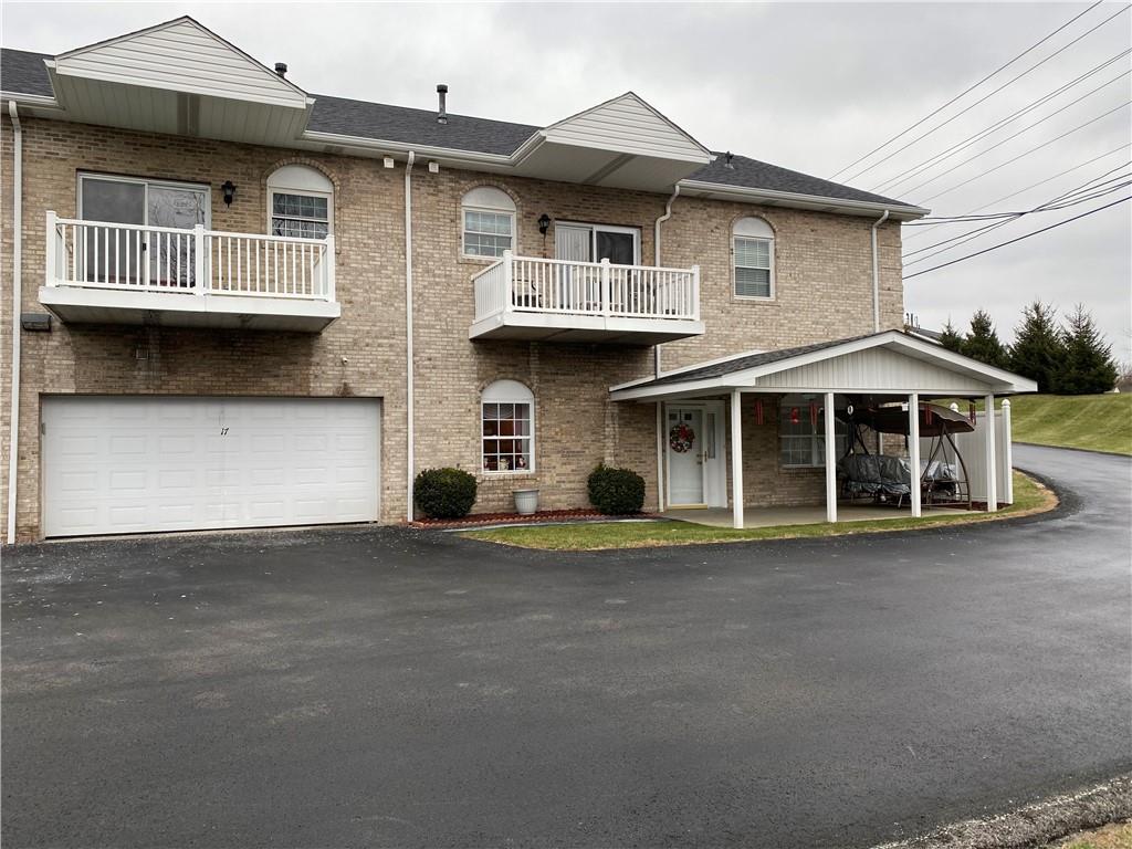17 Elena Avenue Lower Burrell, PA 15068 - Photo 1 of 13 a front view of a house with a yard