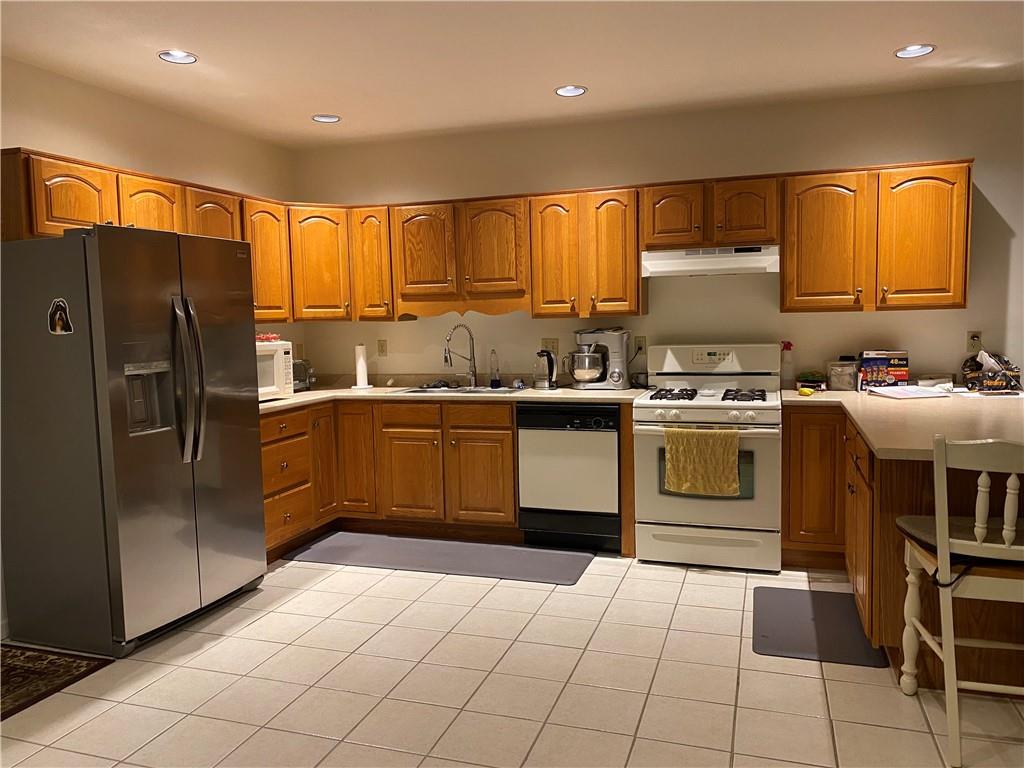 17 Elena Avenue Lower Burrell, PA 15068 - Photo 3 of 13 a kitchen with a sink appliances and cabinets