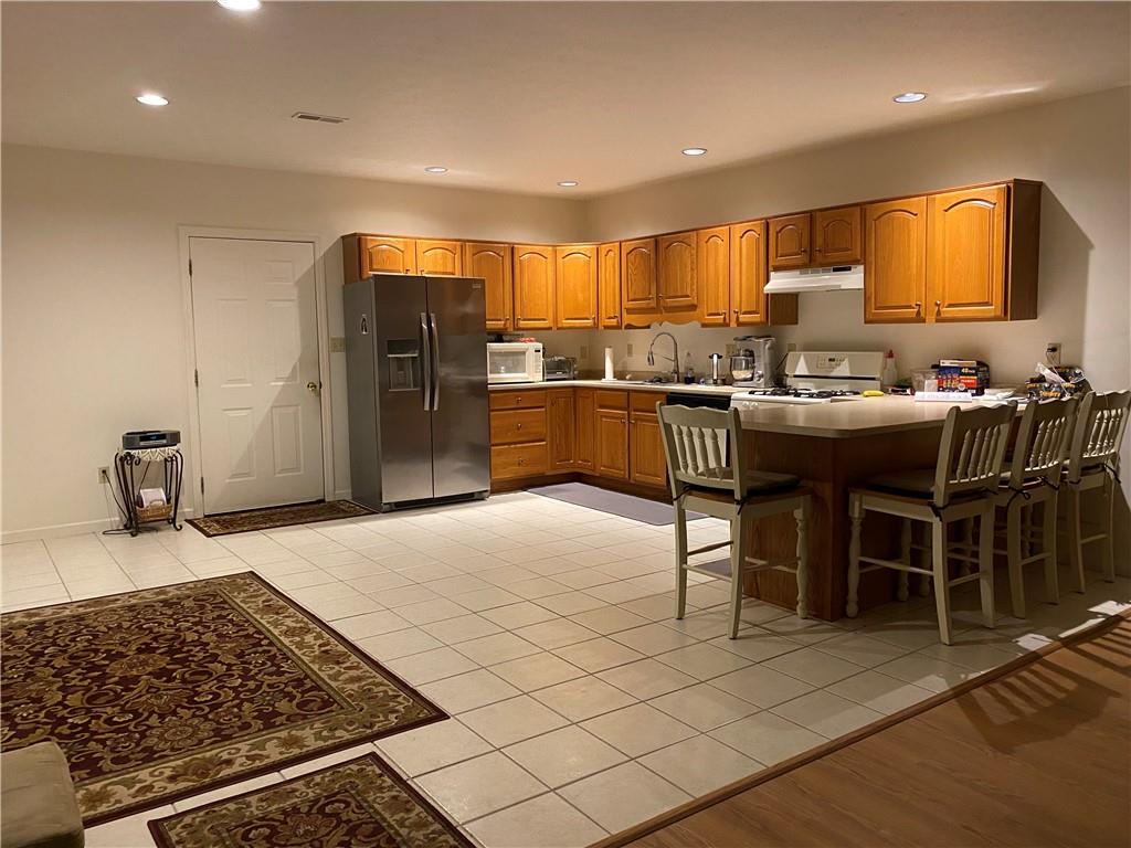 17 Elena Avenue Lower Burrell, PA 15068 - Photo 4 of 13 a kitchen with a sink and cabinets