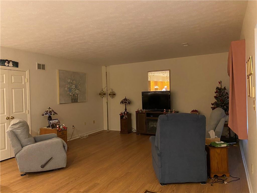 17 Elena Avenue Lower Burrell, PA 15068 - Photo 6 of 13 a living room with furniture and a flat screen tv