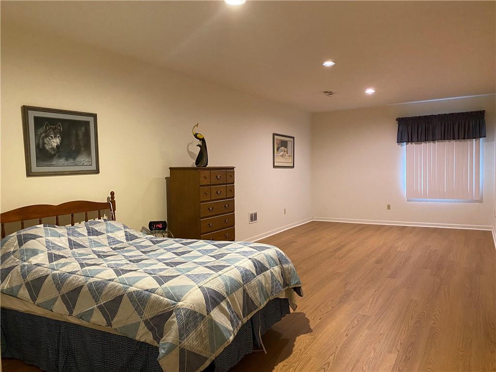 17 Elena Avenue Lower Burrell, PA 15068 - Photo 8 of 13 a bedroom with a bed and a window