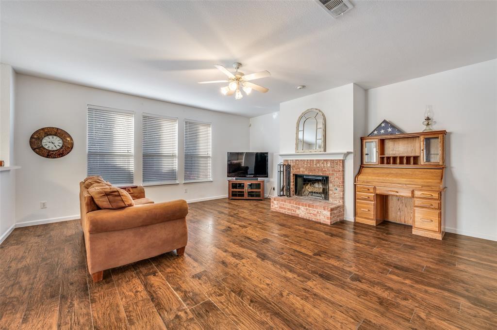 2516 Quail Ridge Road Melissa, TX 75454 - Photo 11 of 30 a living room with furniture and a fireplace