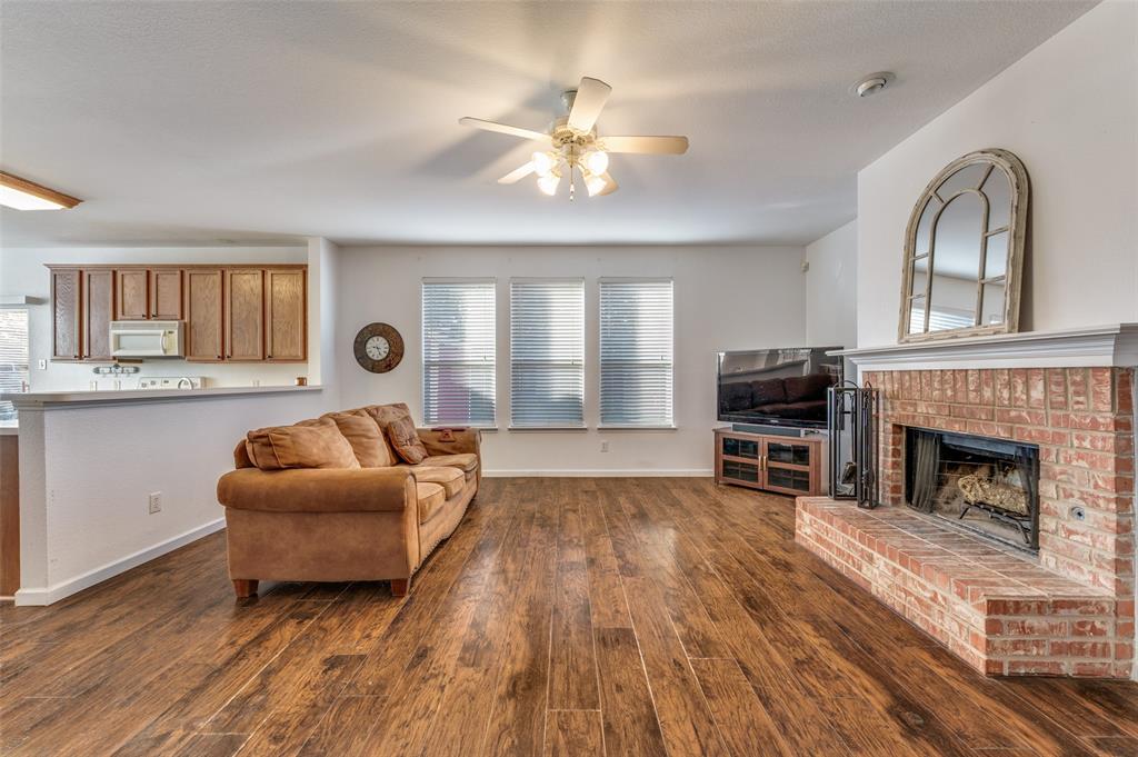 2516 Quail Ridge Road Melissa, TX 75454 - Photo 13 of 30 a living room with furniture and a fireplace