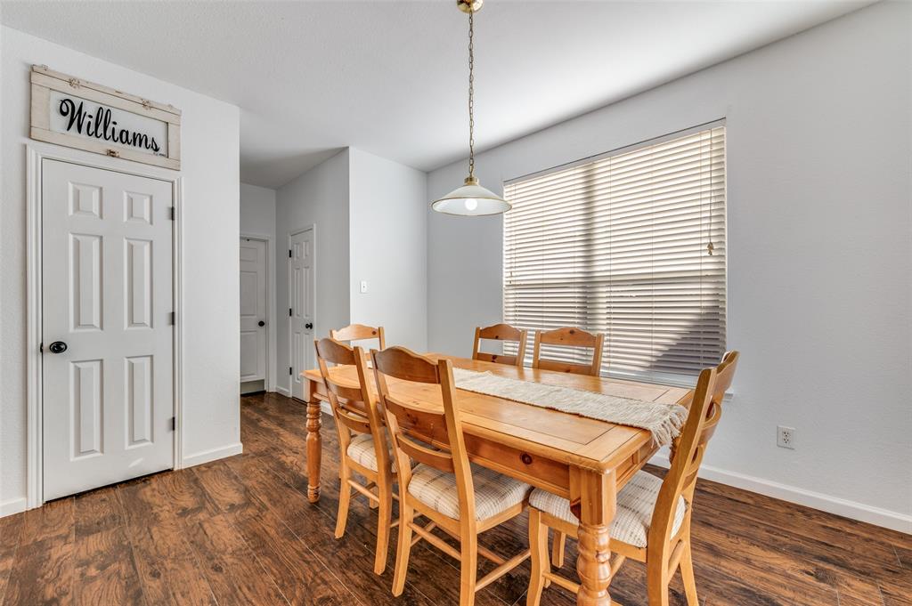 2516 Quail Ridge Road Melissa, TX 75454 - Photo 16 of 30 a view of a dining room with furniture window and wooden floor