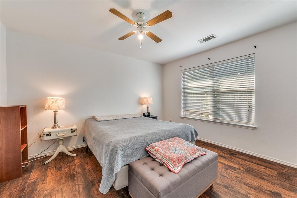 2516 Quail Ridge Road Melissa, TX 75454 - Photo 21 of 30 a bed room with a bed and a chair