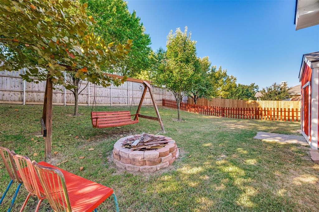 2516 Quail Ridge Road Melissa, TX 75454 - Photo 27 of 30 a backyard of a house with table and chairs