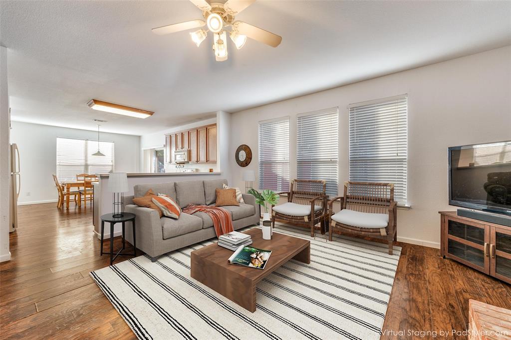 2516 Quail Ridge Road Melissa, TX 75454 - Photo 3 of 30 a living room with furniture and a flat screen tv