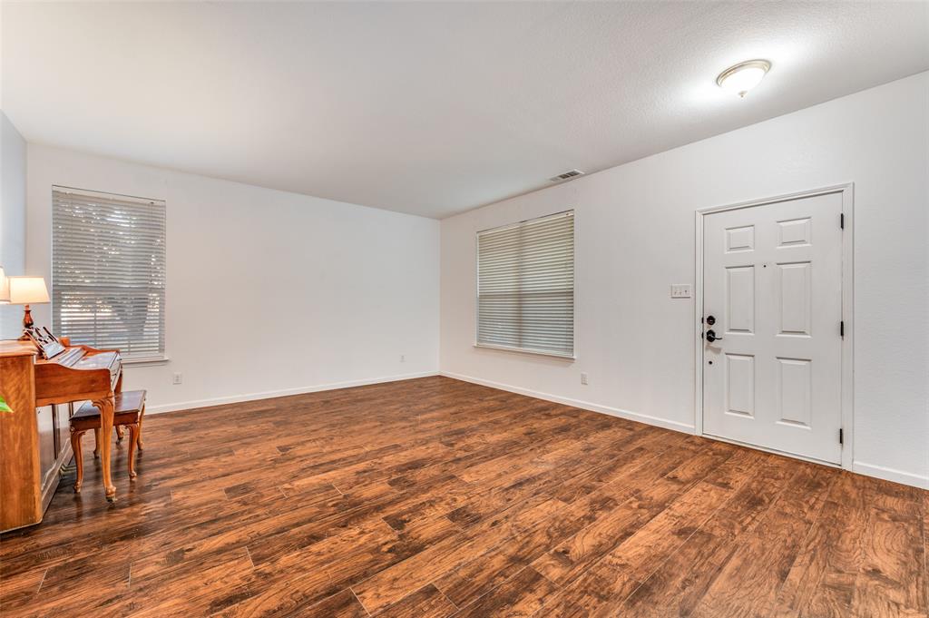 2516 Quail Ridge Road Melissa, TX 75454 - Photo 6 of 30 wooden floor in an empty room with a window