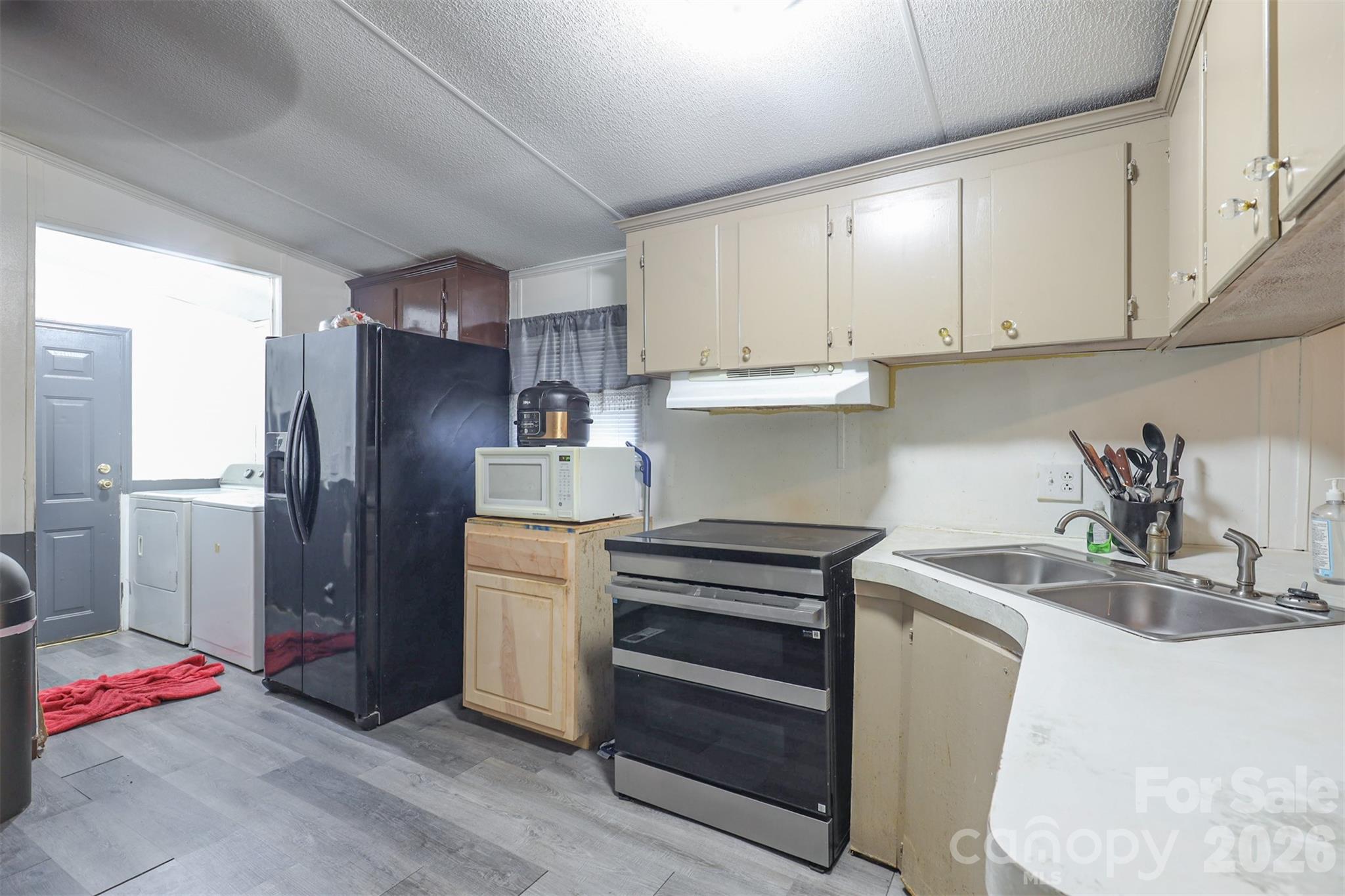 1224 Astoria Road Jamesville, NC 27846 - Photo 11 of 34 a kitchen with granite countertop a refrigerator and a sink