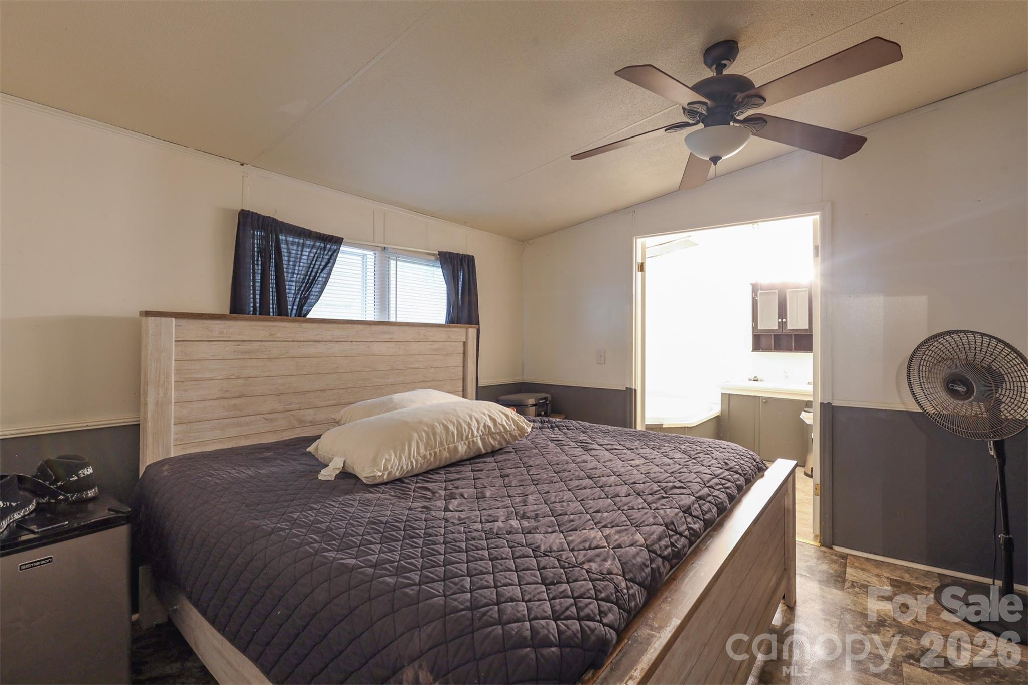 1224 Astoria Road Jamesville, NC 27846 - Photo 16 of 34 a bedroom with a bed and wooden floor