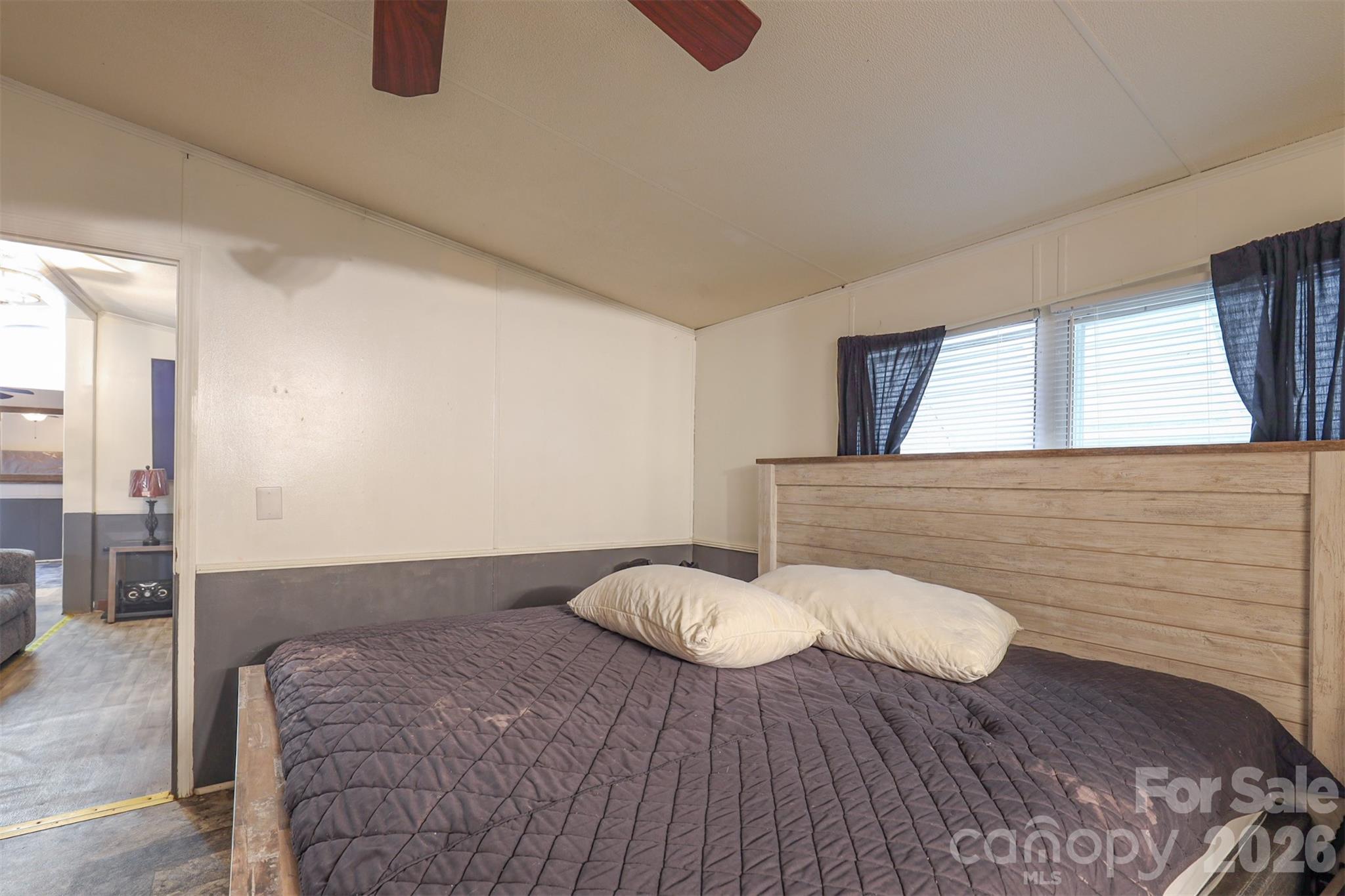 1224 Astoria Road Jamesville, NC 27846 - Photo 17 of 34 a bedroom with a bed and wooden floor