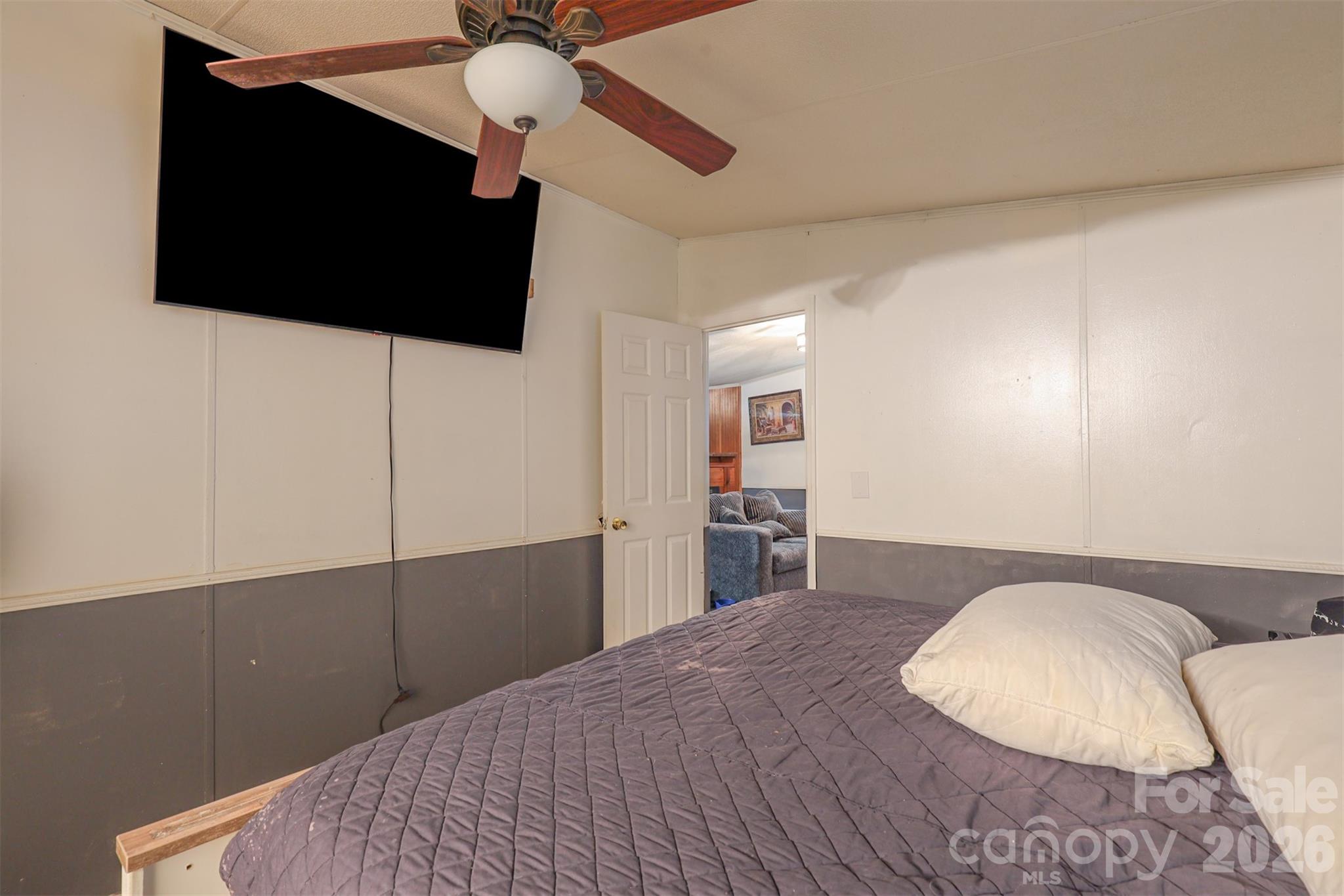 1224 Astoria Road Jamesville, NC 27846 - Photo 18 of 34 a bedroom with a bed and a flat screen tv