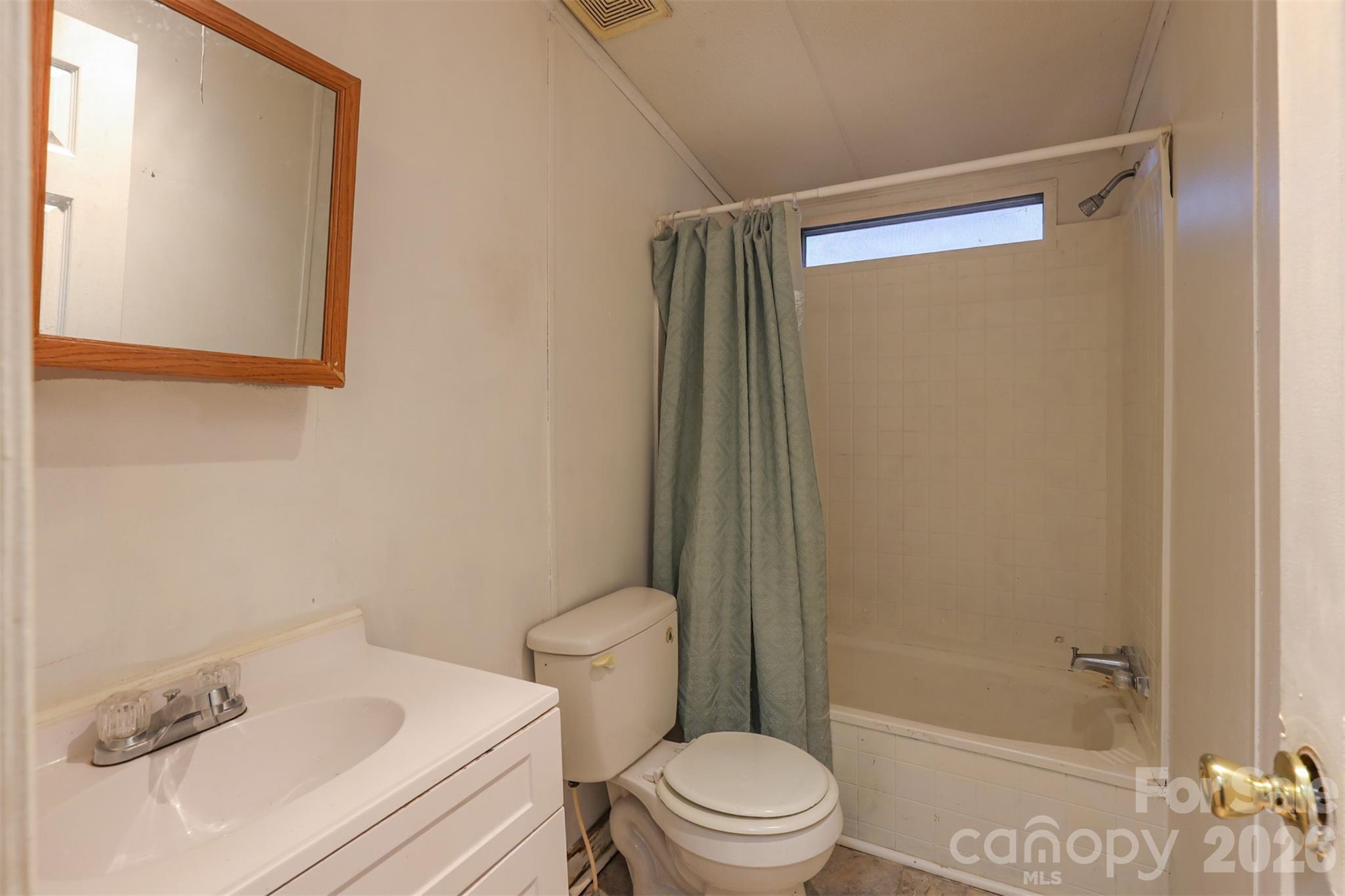 1224 Astoria Road Jamesville, NC 27846 - Photo 23 of 34 a bathroom with a sink and a mirror