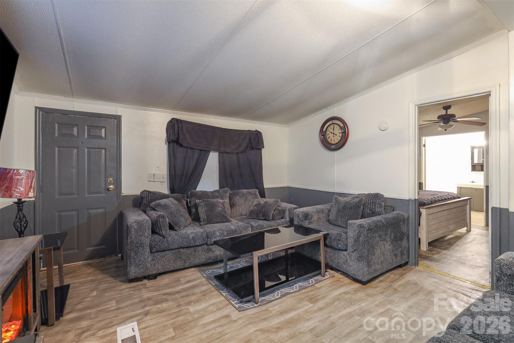 1224 Astoria Road Jamesville, NC 27846 - Photo 6 of 34 a living room with furniture window and wall clock