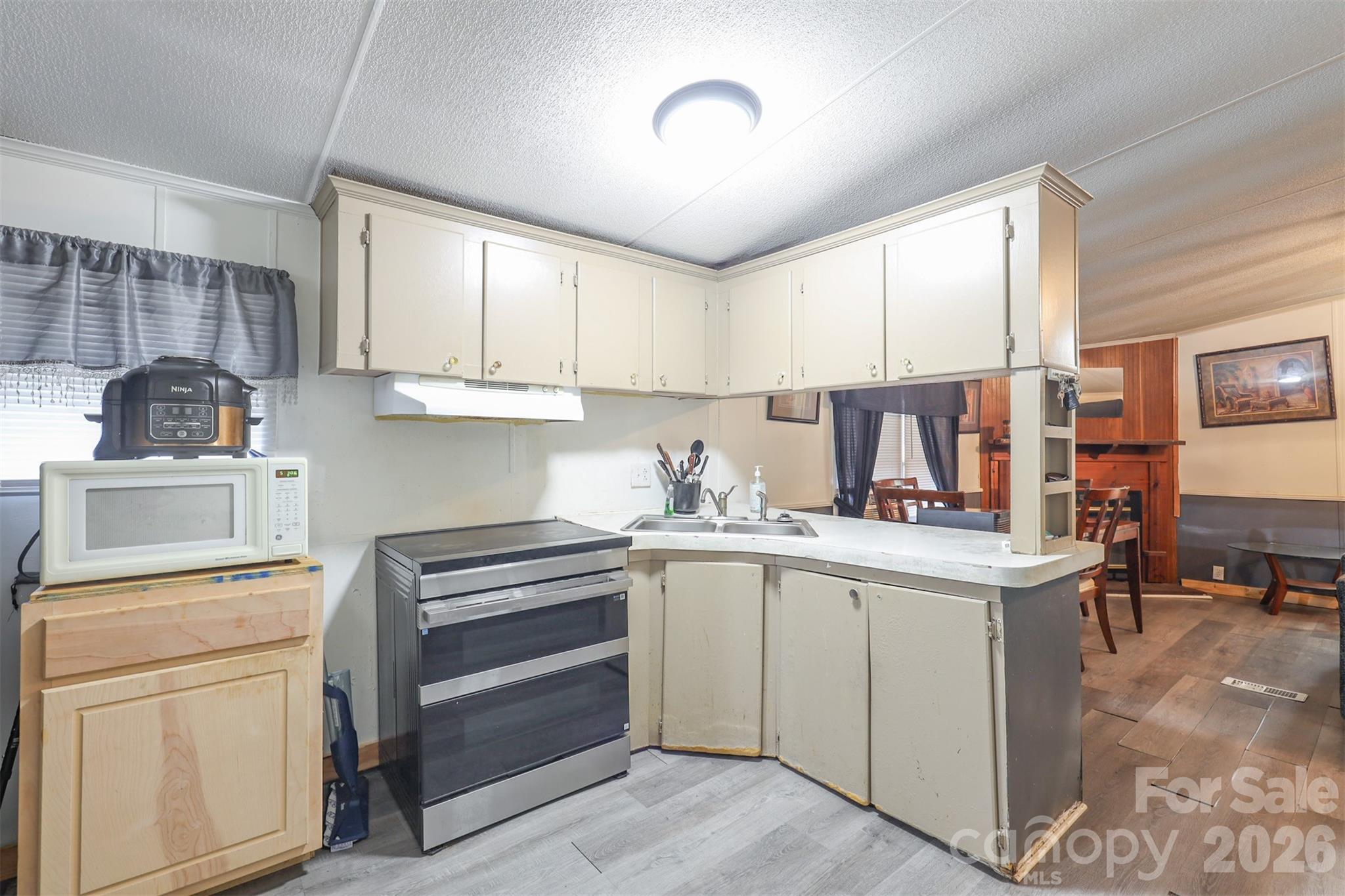 1224 Astoria Road Jamesville, NC 27846 - Photo 10 of 34 a kitchen with a sink stove and cabinets