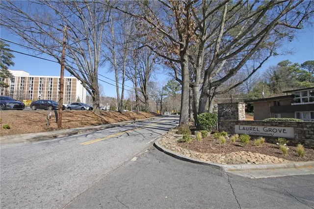 a backyard of a house with barbeque oven and outdoor seating