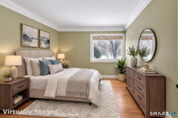 a bedroom with bed and a window