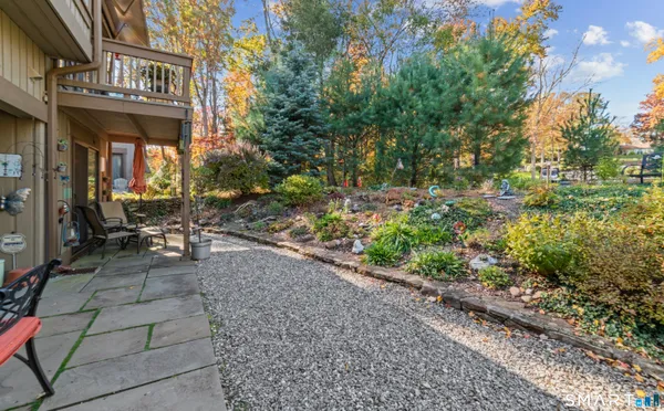 a view of a patio with table and chairs and potted plants
