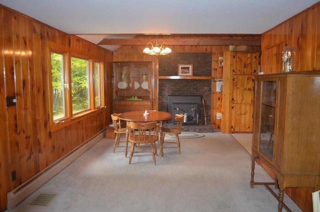 96 Swett Road Windham, ME 04062 - Photo 11 of 26 Dining area with fireplace insert.