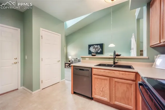 a kitchen with sink stove and cabinets