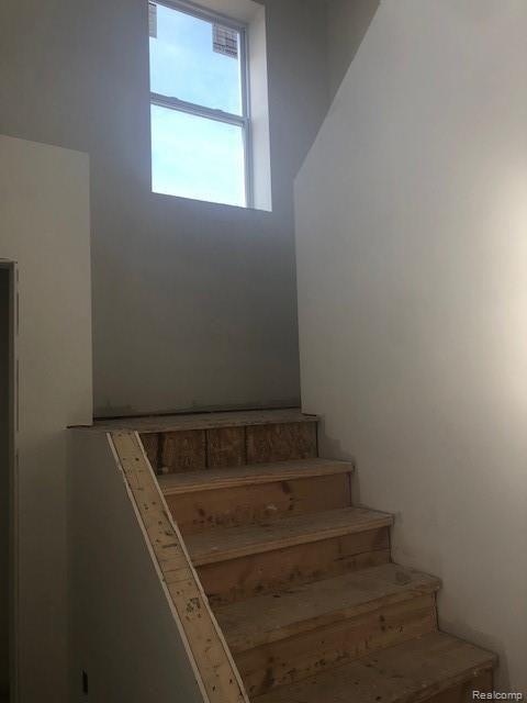 Open Staircase in Foyer with window on landing