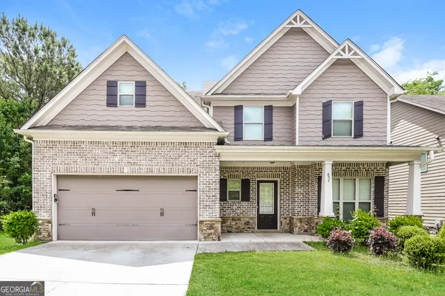 a view of a yard in front view of a house