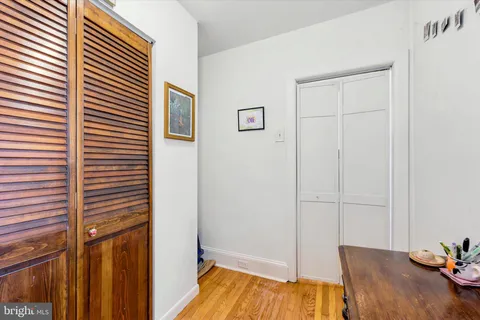 a view of a bedroom with a bed