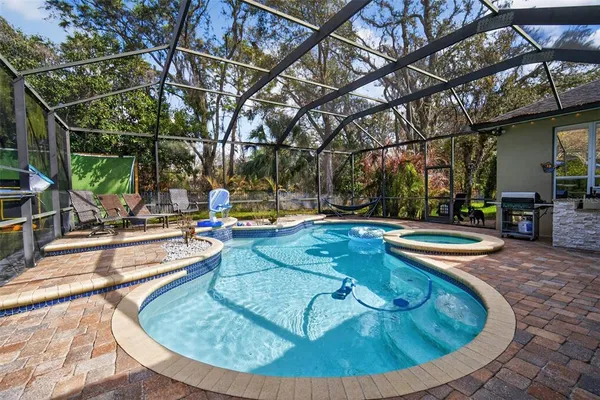 a view of a swimming pool with a sitting area