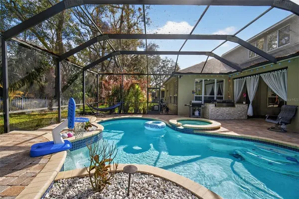 a view of a swimming pool with a patio