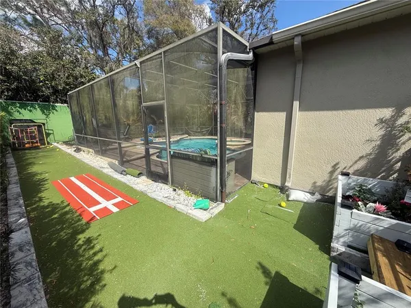 a view of a backyard with a patio
